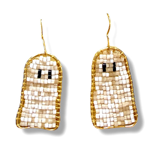 Gold and silver ghost-shaped earrings on a white background